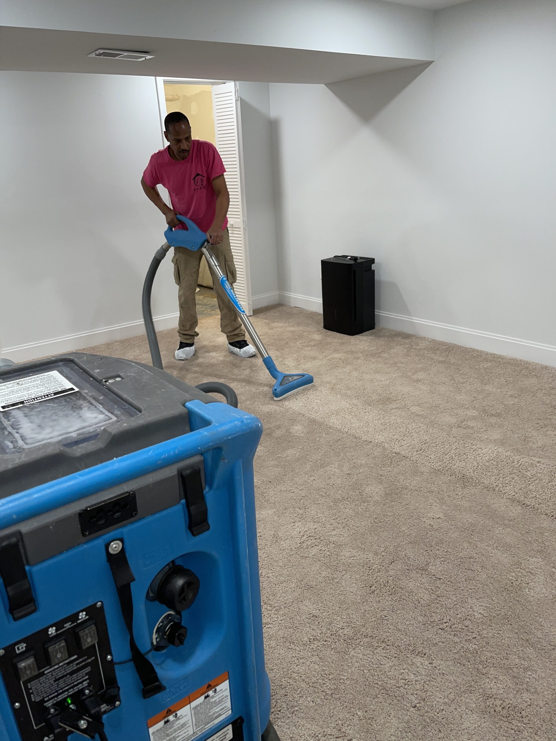 technician restores water damaged carpet