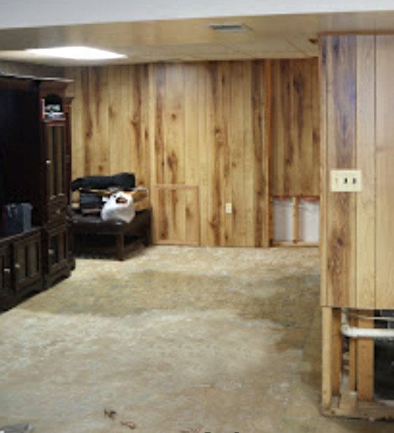 a wet basement floor is a sign of water damage