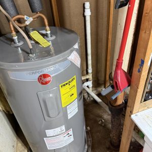 Water heater installed in a utility area.