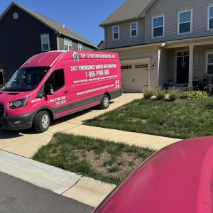 Top To Bottom Renovation service van parked outside a residential home, representing professional water damage restoration and renovation services.